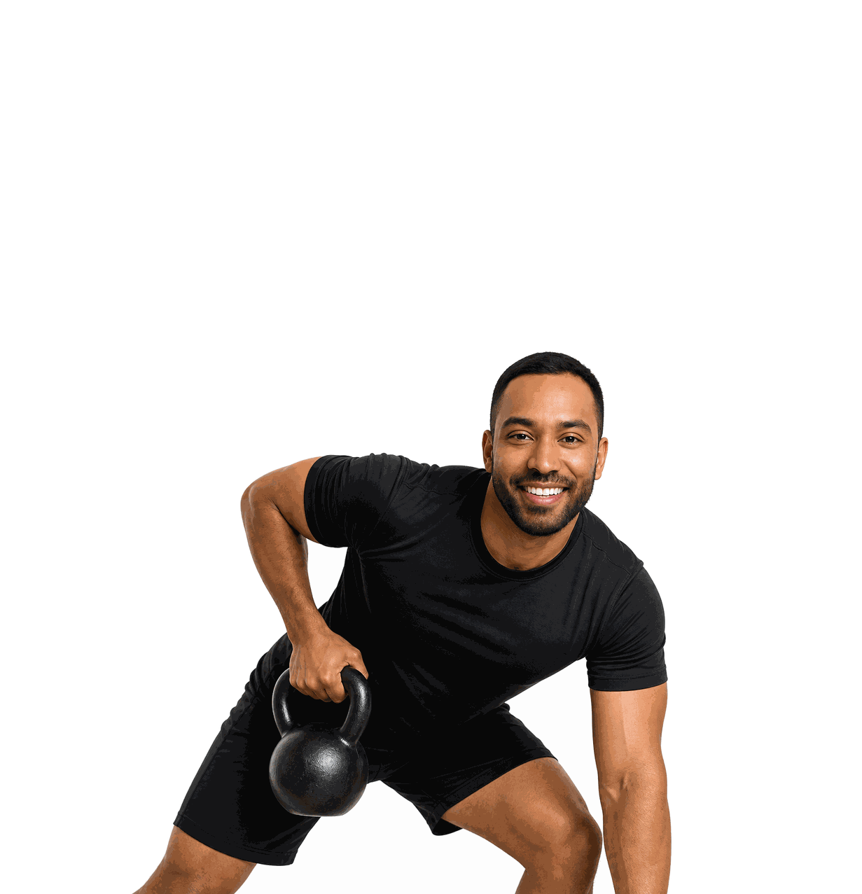 Smiling man training with a kettlebell during a FFAST FIT functional strength class in Roanoke, Virginia.